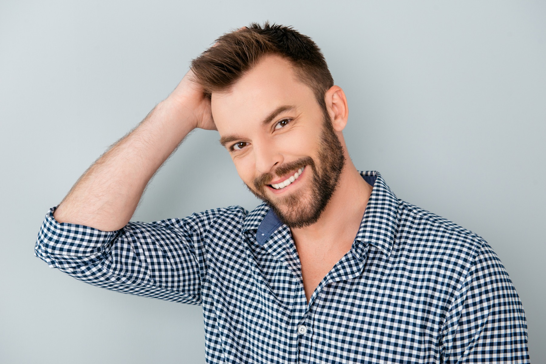 man touching hair